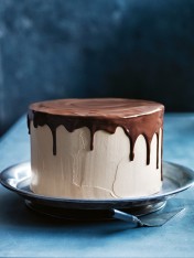 caramel butter cream layer cake with drippy chocolate glaze